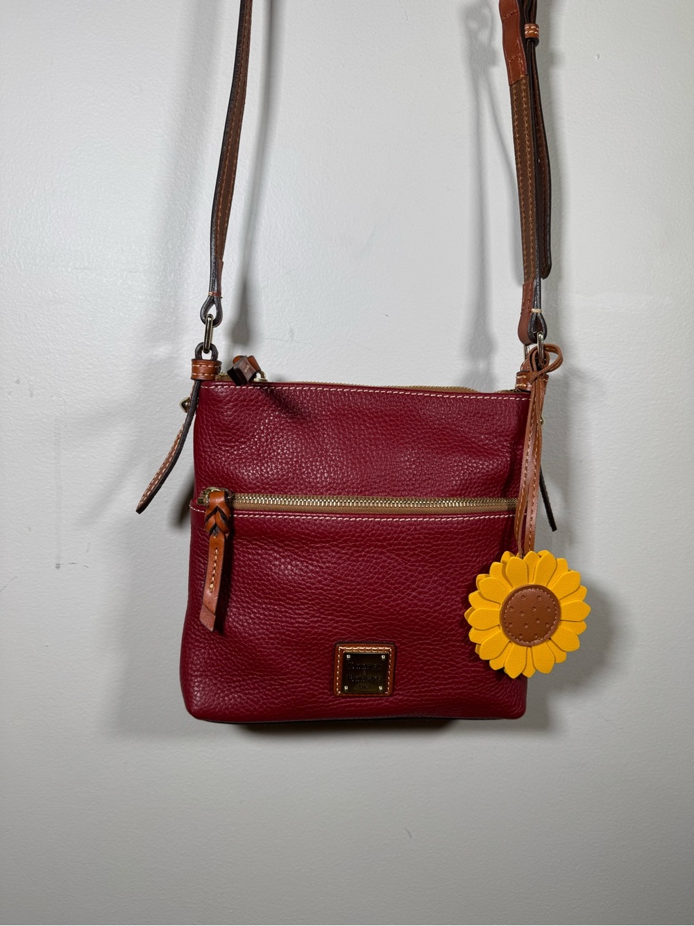 Dooney & Bourke Burgundy Pebble Leather Crossbody with Yellow Sunflower Charm